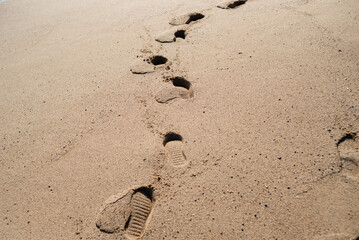 Footprints in the sand. Beach on the shores of the Mediterranean Sea.