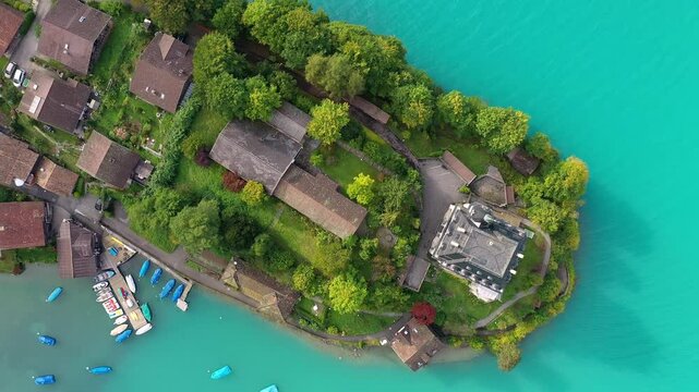 Iseltwald, Switzerland: Aerial overhead drone footage of the famous Iseltwald village by lake Brienz in the Berner Oberland.