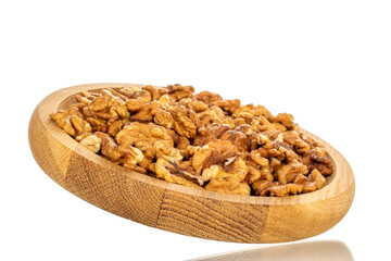 Shelled walnuts on a wooden plate, close-up, isolated on a white background.