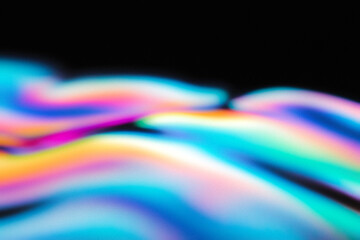 Iridescent colorful light trails creating a blurred abstract background