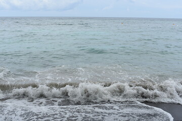 Raging sea waves by the beach seaside view