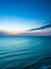 A smooth abstract gradient transitioning from midnight blue to pale aqua, evoking a calm twilight atmosphere