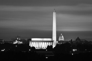 Washington DC cityscape in sunrise with major city monuments including the Lincoln Memorial and...
