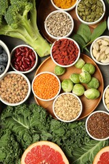 Superfood. Different healthy food products on grey table, flat lay