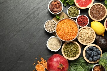 Superfood. Different healthy food products on grey table, flat lay. Space for text
