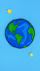 Naklejka premium Handmade, children's art. Planet earth on a blue background, pixel art, with white tones