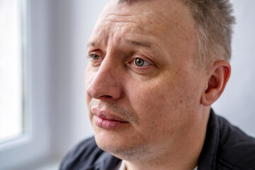 distorted face of sad and grieved very upset person, dissatisfied with his hard fate