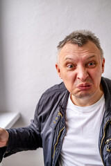 distorted face of sad and grieved very upset person, dissatisfied with his hard fate