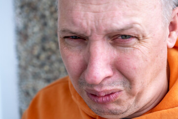 distorted face of sad and grieved very upset person, dissatisfied with his hard fate