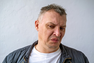 distorted face of sad and grieved very upset person, dissatisfied with his hard fate