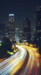 Obraz premium A stunning urban nighttime scene showcasing tall skyscrapers and light trails from moving vehicles, capturing the dynamic essence of city life.
