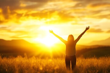 Silhouetted Figure Embracing a Vibrant Sunrise Over an Open Field Symbolizing New Beginnings and