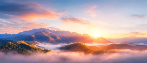 Majestic sunrise over misty mountain range.