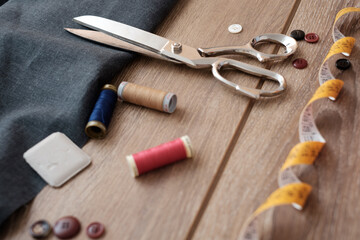 Tailor tools isolated on wooden background