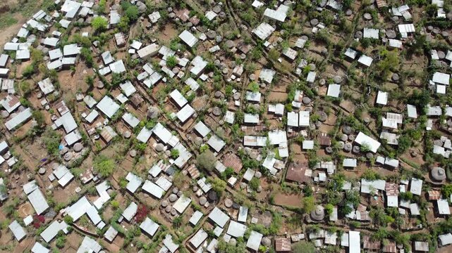 Aerial straight down view of densely packed buildings with tin roofs in Konso, Ethiopia, Africa.