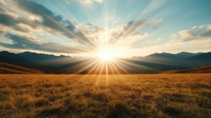 A stunning sunset radiates over golden fields and distant mountains, creating a breathtaking view that evokes tranquility and the timeless allure of nature's grandeur.