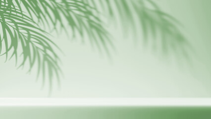 Fototapeta premium Minimalistic clean pastel light green background. Exhibition podium for product presentation with beautiful light beams from the window on the wall and floor, and shadow from palm leaves