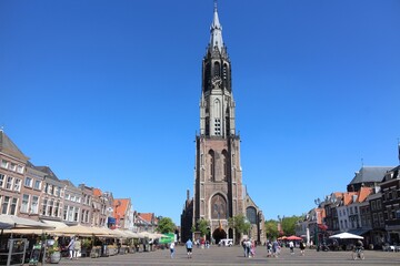 Fototapeta premium The Nieuwe Kerk (New Church) tower in the old town of Delft, Netherlands