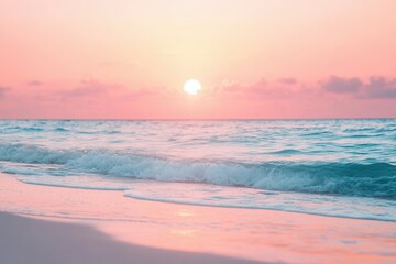 Serene pink sunset over tranquil ocean waves at sandy beach.