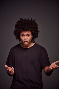 Studio Portrait of a young mixed race man.