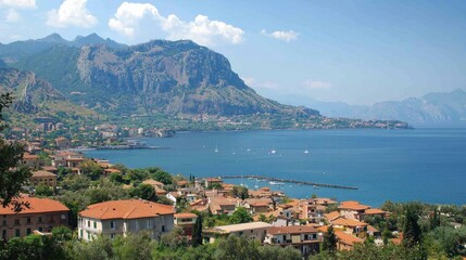 Fototapeta premium Coastal Town Nestled Amongst Majestic Mountains and Azure Sea