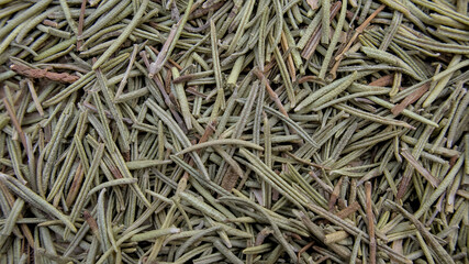 Detailed Macro Shot of Dried Rosemary on Wooden Surface
