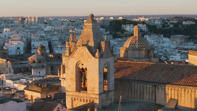 Aerial drone view of the cathedral in the old town center of Ostuni in Puglia, Italy.