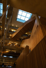 Multi-level angular wooden stairway view from below