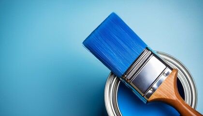 paint brush and can blue paint on background