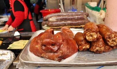 Pig head and leg on a butcher's shelves in Gwangjang Market, Seoul, South Korea