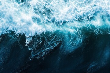 Ocean waves with white foam on a dark blue background.