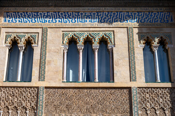Walls of palace in historical Andalusian town Seville, Spain. View on houses, architectural details of buidings. Summer in Andalusia.