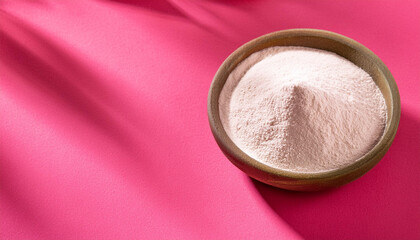 collagen powder on pink background