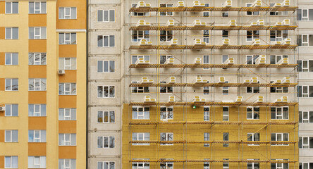 Thermal insulation works of the facade of a apartment building with mineral wool plates