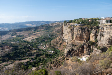 Walking in Ronda, touristic town in Andalusia, Pueblo Blanco white village, Spain. Historical buildings, walls and fortress.