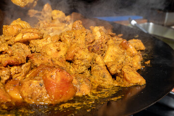 Street food, spicy pieces of meat from the grill for shawarma or kebab on weekly food market in London