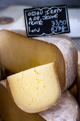 Piece of tasty Ossau-Iraty or Esquirrou sheep cheese produced in south-western France, Northern Basque Country, translation yellow, fruity AOP