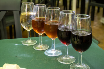 Flight of five sherry wine from barrels, fino, manzanilla, olorosso, amontillado, pedro ximenez jerez wines in old tavern, wine tasting, Sanlucar de Barrameda, Cadiz, Andalusia, Spain