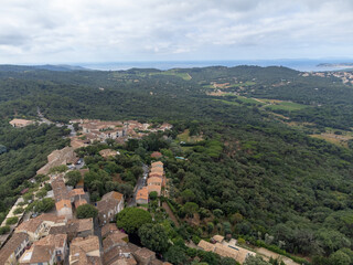 Landscape of French Riviera, view on hills, houses and green vineyards from above Cotes de Provence, production of rose wine near Saint-Tropez and Pampelonne beach, Var, France