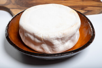 Cheese collection, French reblochon de savoie gratin cow milk cheese close up