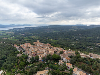 Fototapeta premium Aerial view on green hills, houses, gulf of saint-tropez, Gassin village, vineyards, Provence, Var, France