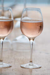 Summer time in Provence, two glasses of cold rose wine with blue sea view on background, French Riviera near Menton, south of France