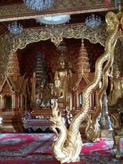 Golden Buddha statue in Temple, Wat Phraphutthabat Si Roi, Buddhist temple in the Saluang, Chiang Mai, Thailand