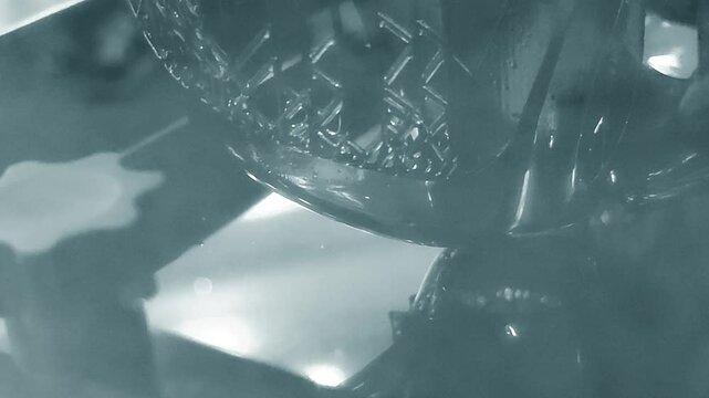 Process working 3D printer. 3D printing from liquid material close-up. Photopolymer hardened under ultraviolet laser. Stereolithography photopolymerization. SLA. Additive manufacturing technology