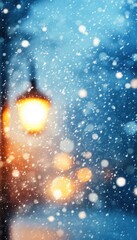 Snowfall at night, warm light from a street lamp creates a cozy winter scene.