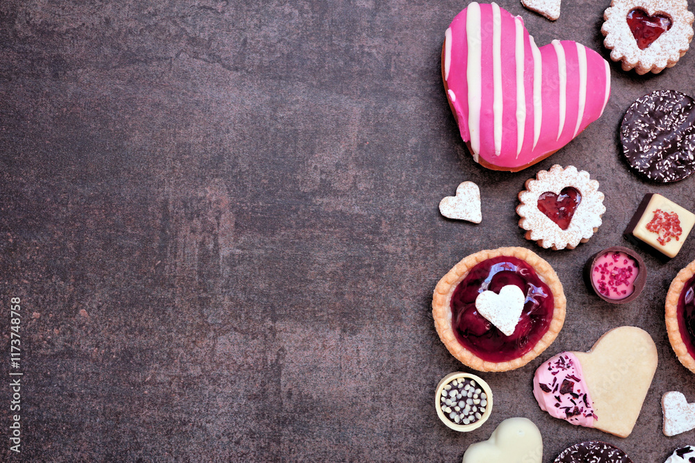 Poster valentines day baking and sweets side border with a variety of cookies, chocolates and sweet treats.