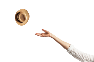 Person reaching for a straw hat against a white background during a bright moment of joy