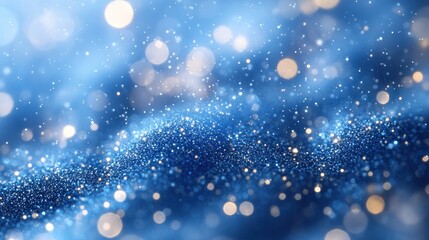 Obraz premium A shimmering blue background with sparkling particles creating a dreamy atmosphere.