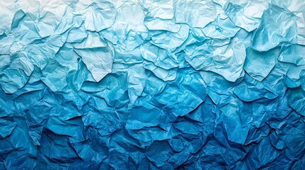 Obraz premium Textured blue background resembling ocean waves created with crumpled paper