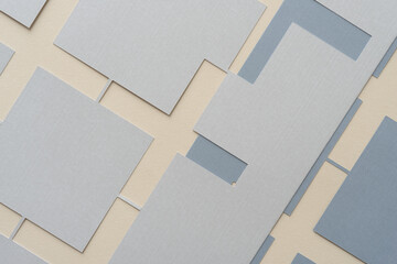gray machine-cut geometric stencils with plus shapes on a relatively flat surface